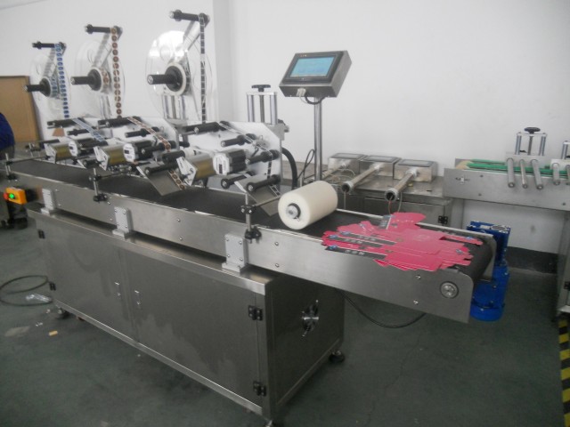 平面不干胶贴标机工作原理介绍 平面不干胶贴标机工作原理介绍